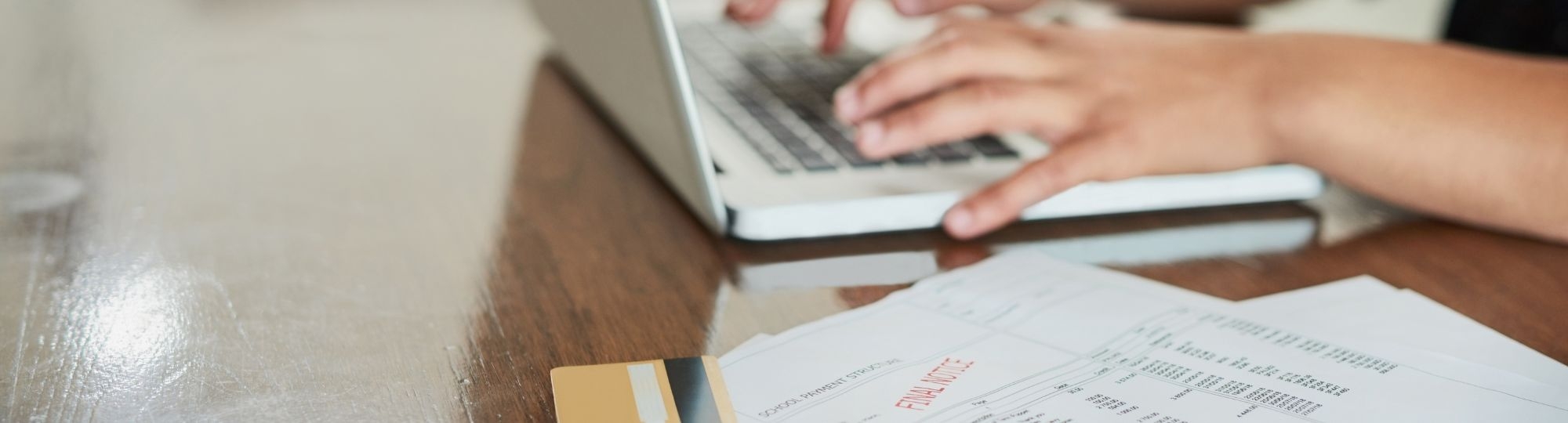 Person on computer with overdue final notice